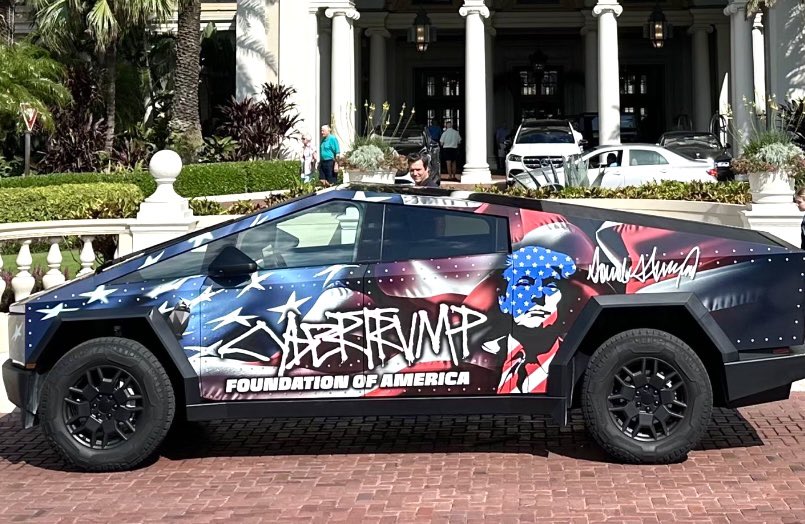 RonFilipkowski's tweet photo. “CyberTrump” Tesla vehicle outside Mar-a-Lago. https://t.co/fFOZFvyMZI