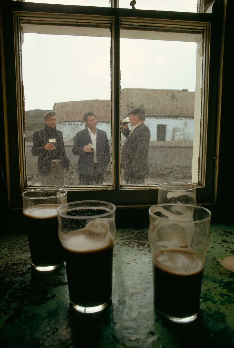 Livestock traders drinking outside a pub on Inis Meáin island, 1971.