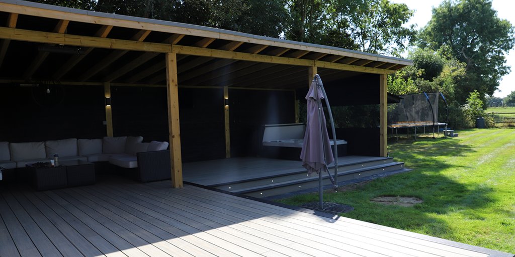 Check out this Antique composite decking for this fantastic hot tub build!