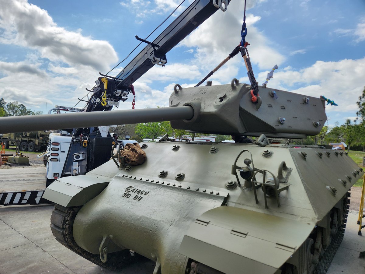 ww2armor's tweet photo. Now hear this!

Work continues here at WW2 Armor on our February 1943 built M10 Gun Motor Carriage (GMC) used by the U.S. Tank Destroyer Forces during World War II.

Over the last year we re-configured it back to its original World War II configuration as it was heavily modified by the Israelis in the late 1950s as part of their M50 Program. As part of the program, the Israelis made numerous modifications and changes to the layout of the hull, gun, and turret which required extensive work to bring it back to its original World War II build. There are some bits on the hull from the Israeli experimental program we have opted to retain, but for the most part it's back to its original design.

This week, our team installed the M10’s fuel and oil tanks, and began the electrical wiring for the vehicle electrical systems. The M10 had the fuel capacity of 165 gallons (620 liters) with an operational range of approximately 200 miles (320 kilometers). Yesterday, we installed a General Motors 6046 twin diesel engine after an extensive overhaul and services by our maintenance department. (the engine this particular piece came with) The 6046 twin diesel was capable of producing 375 horsepower at 2,100 rpms, and enabled the M10 to have a max speed of between 25 to 30 miles per hour (40 to 48 kilometers per hour).

Once installed, our team then carefully and safely installed the M10’s turret and Mount M5 with the 3-inch gun M7 into the hull. It was a moment our team has been waiting for as there is something truly unique about the M10’s appearance. Even though it may look complete there is still much more work to be done, and we will keep you all posted as we progress.
If you are interested in reading our research article published in July 2021 on the history of our M10 GMC we invite you to read it at this URL:

https://t.co/APrZPorStD...

From our team here at WW2 Armor, we wish you all a wonderful weekend!

That is all.