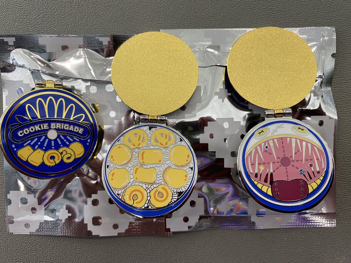 Favorite of the @pinny_arcade pins this year has to be the charity Cookie Brigade’s. It’s comes in a sealed foil bag due to the cookie tin pin inside being 75% chance mimic with button eyes and needle teeth, 25% chance cookies. #PAXEast2024