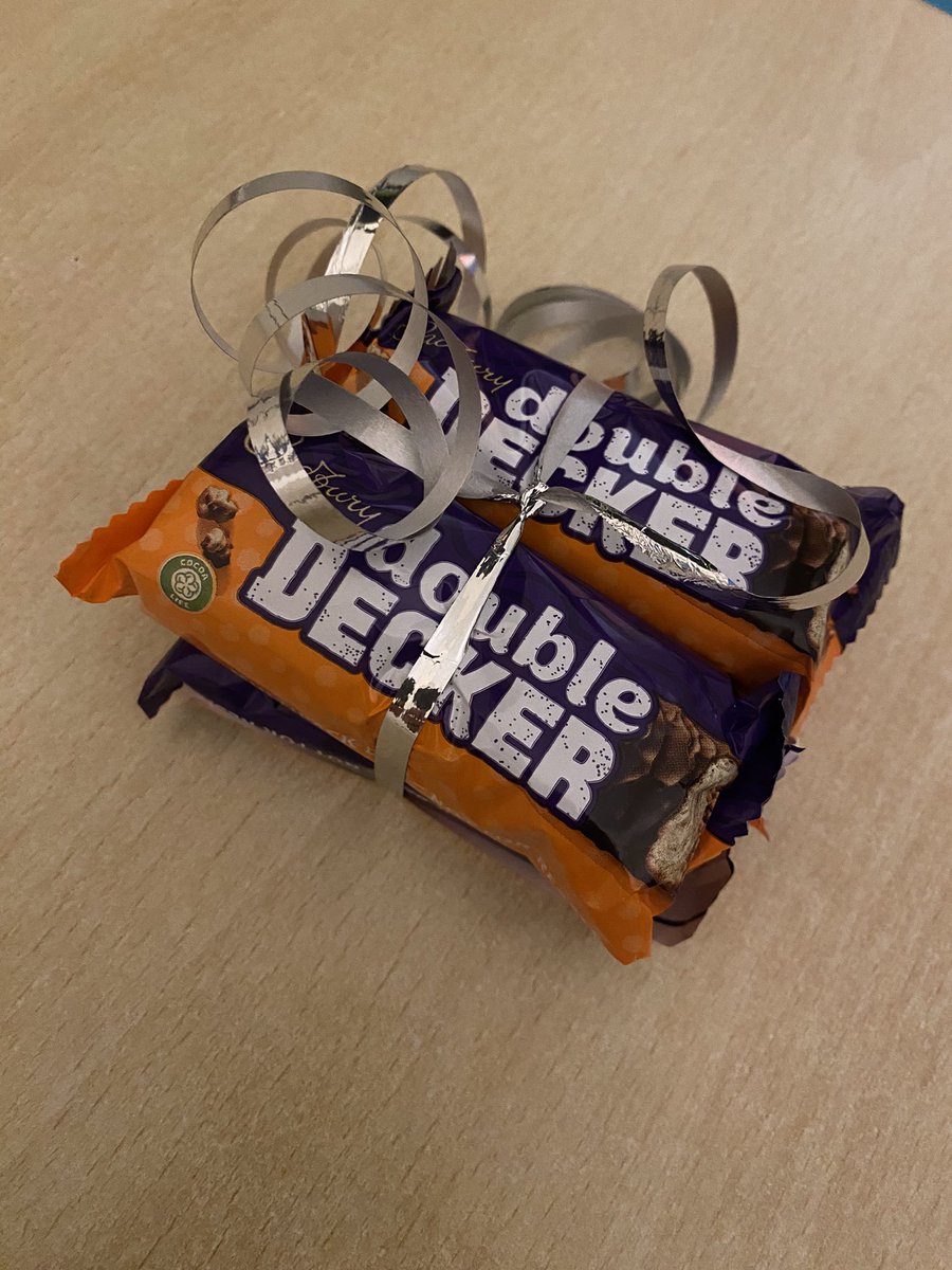 PrimaryMrBrown's tweet photo. Reason 163 for loving my job: the incredible @LEARNwithFA1 don’t just facilitate and organise all our ECT and NPQ programmes, but leave artistically wrapped, surprise Double Deckers on your desk. https://t.co/XdXQmwgEF1