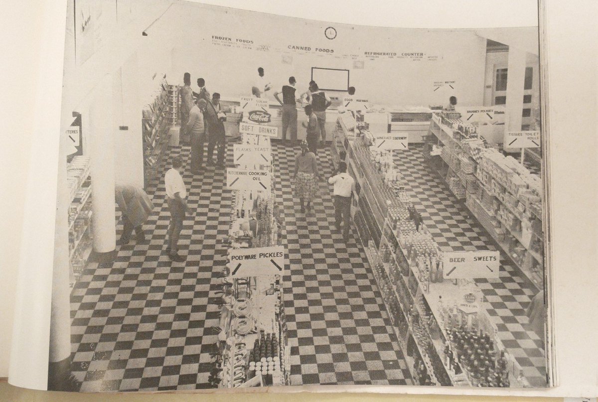 I am intrigued by this overhead view of a supermarket in Malawi (Blantyre) circa 1964 and the dedication of entire sections to both pickles and flasks.