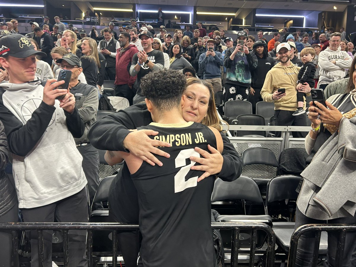 KJ shares a moment with his mom after hitting that buzzer beater. Colorado Buffaloes legend.