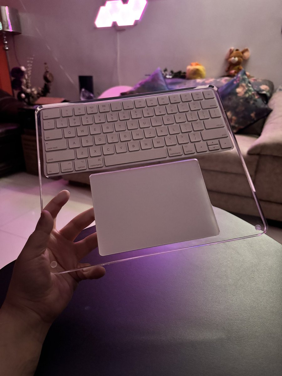 TaimurAsad's tweet image. My new desk setup ᯅ 
P.S. Loving this case for Magic Keyboard+Trackpad. Kinda complements translucent interface of visionOS. 
#VisionPro #SpatialComputer