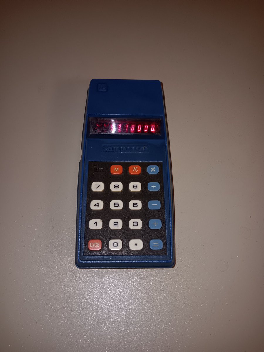 herdware's tweet image. So I found another (cheap) Commodore calculator. The back is very worn but it looks like model 796M. Basic four function calculator. Very nice blue color which the cheap phone camera falls to do justice. One more digit than 776M. #keepitcommodore