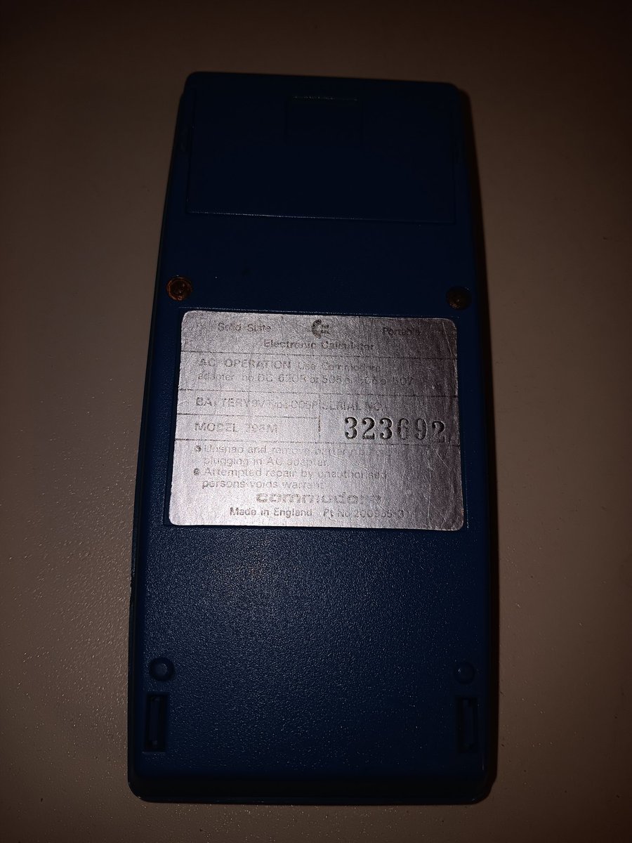 herdware's tweet image. So I found another (cheap) Commodore calculator. The back is very worn but it looks like model 796M. Basic four function calculator. Very nice blue color which the cheap phone camera falls to do justice. One more digit than 776M. #keepitcommodore