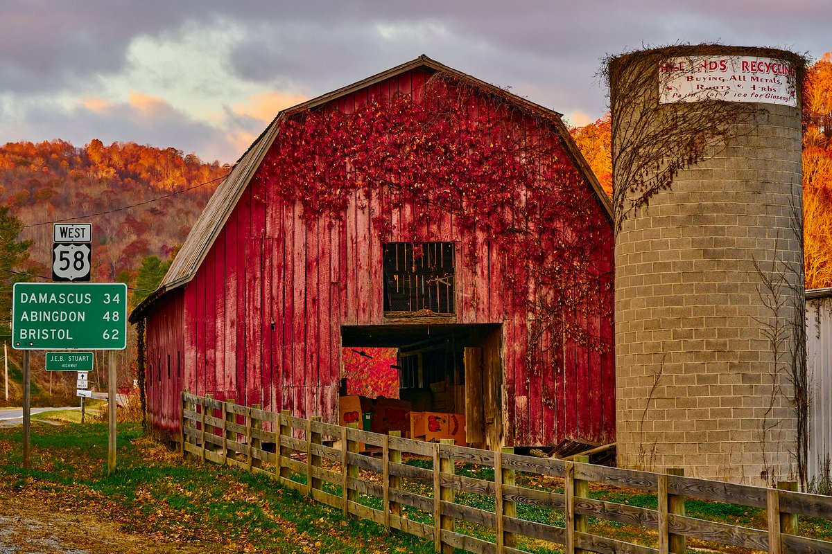 Grayson Highlands State Park in Virginia is just down the road from this red barn. #redbarn #barn #silo #farm #Virginia #graysonhighlands #autumn #fall #fence #photography #fineartphotography #rural #Bristol #Damascus #Abingdon