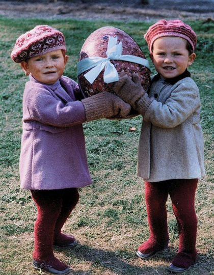 Twins from Castlebar Nursery School in Sydenham, England, who had been evacuated to Mersham-le-Hatch near Ashford in Kent celebrate Easter whilst awaiting adoption. 23rd March 1940.