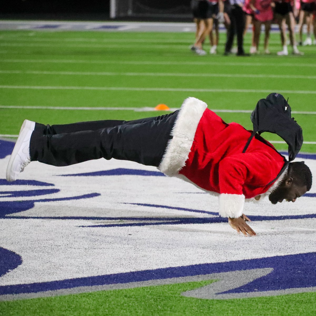 Juniors vs.  Seniors last night at the Pinnacle Powderpuff game. Still not certain  why the elves and Santa suits were donned for this event but it worked  during the halftime performance.  Seniors with the win and the hands  down MVP was, of course, #24.