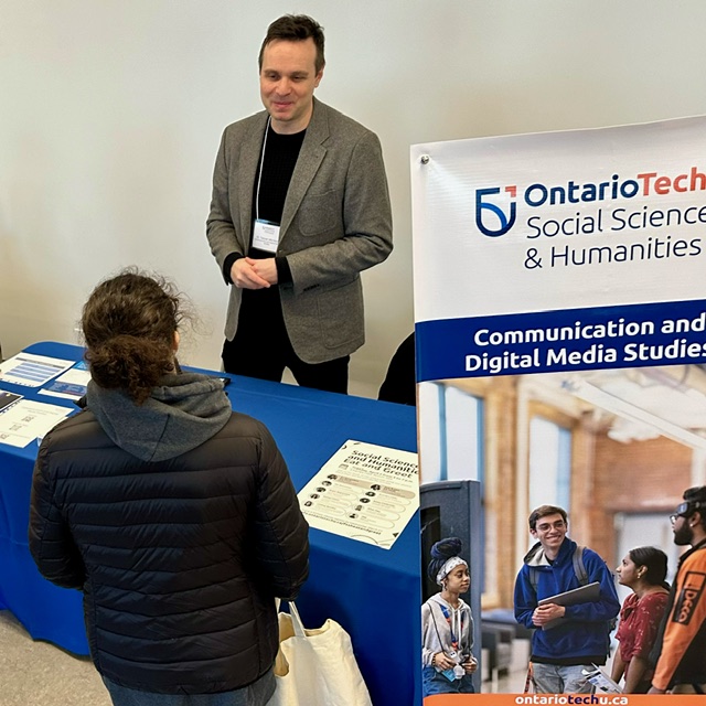 <a href="/OT_CDMS/">Communication and Digital Media Studies</a> Prof <a href="/TMirrlees_/">Tanner Mirrlees</a> , chatting about the program at on-campus Experience  Day <a href="/OT_FSSH/">Ontario Tech Social Science and Humanities</a> <a href="/ontariotech_u/">Ontario Tech University</a> - Check out are exciting new specializations in Creativity, Digital Arts and Entertainment Industries and Strategic Comms, Social Media &amp; Society! …lscienceandhumanities.ontariotechu.ca/cdms/specializ…