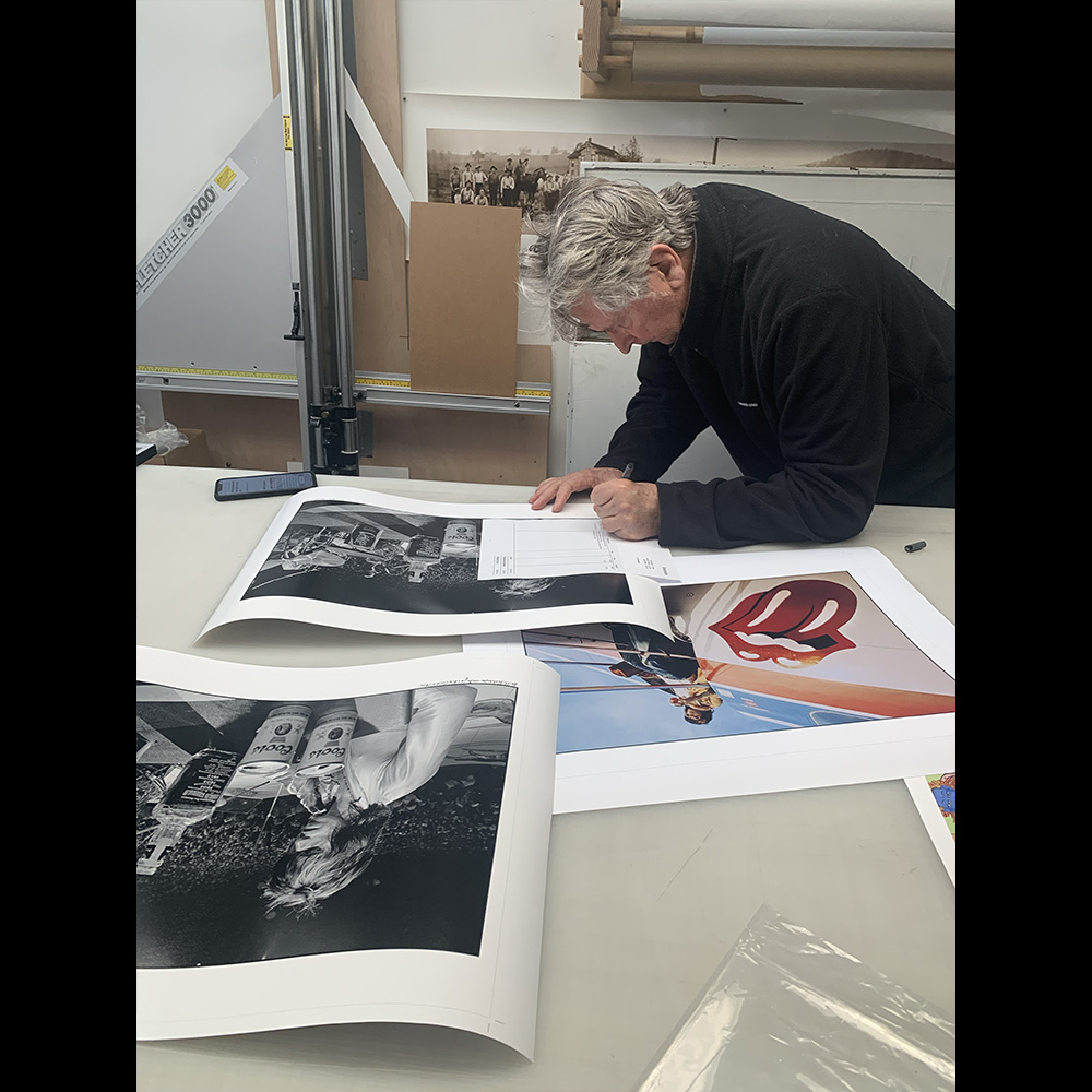 Signing prints at Dickerman's in San Francisco. Photo by Kim. I have a beautiful fine art book ETHAN RUSSELL PHOTOGRAPHS only available at ethanrussell.com (ethanrussell.com). #thebeatles #therollingstones and many more. FREE SHIPPING in United States.