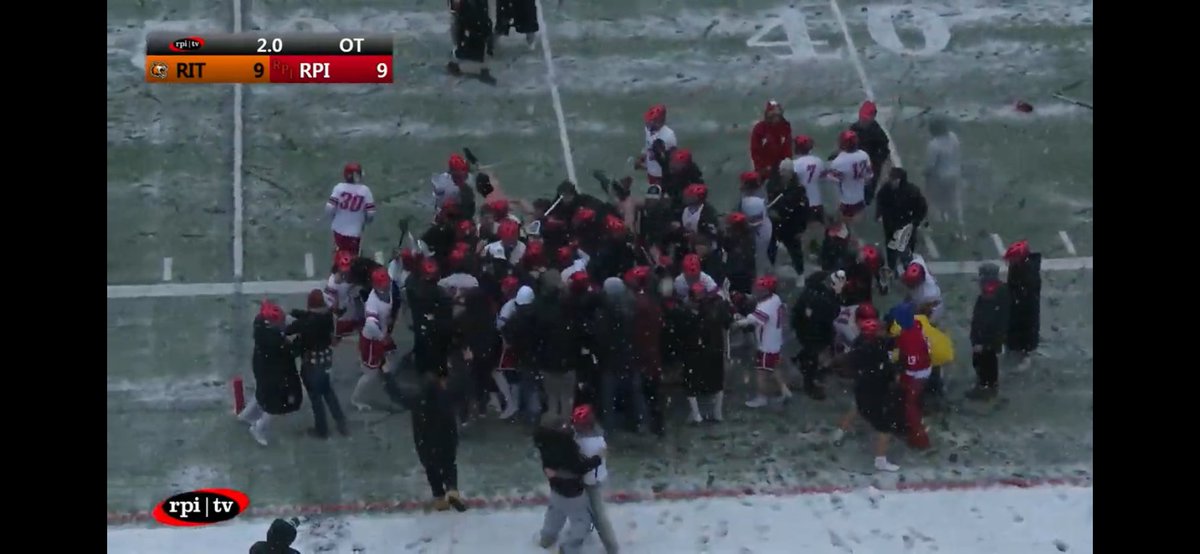 🚨❄️ Down goes No. 2! @RPIMLax Erik Ojert scores with two seconds left in OT for the 10-9 win. Joe Perry with 2 of his 24 saves in the OT. Great game, and a well-done live stream. Quite the scene as students storm the field, though we do question the decision to go shirtless 😂.