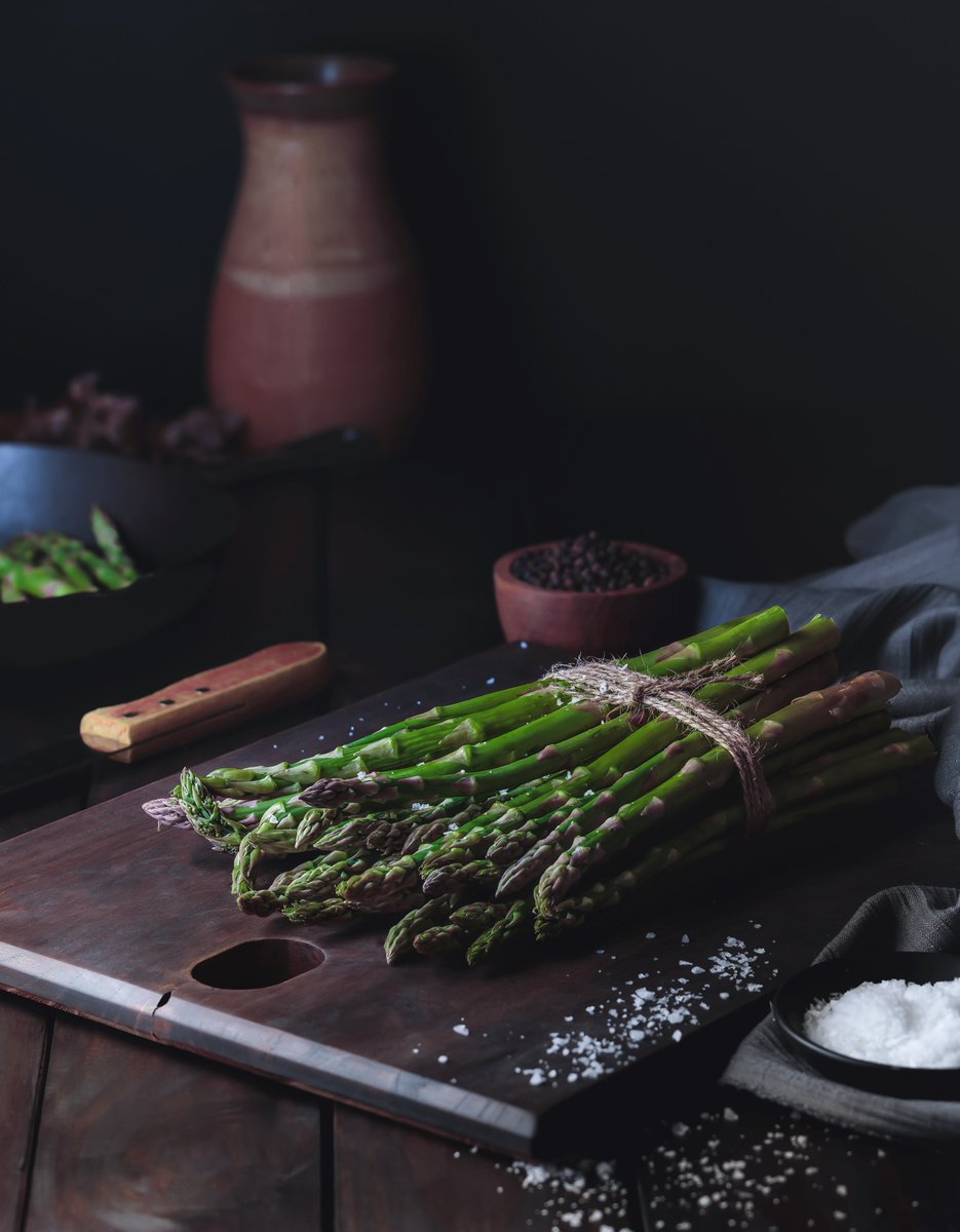 Savour the simplicity: fresh asparagus, a sprinkle of salt, & moody lighting that turns a humble veg into art. 🌿📸 #Foodie #ArtOfPlating #SimpleElegance #EatYourGreens #foodphotography #delicious 
#foodie #yum #foodporn #Photography #PhotoOfTheDay #InstaPhoto #PicOfTheDay