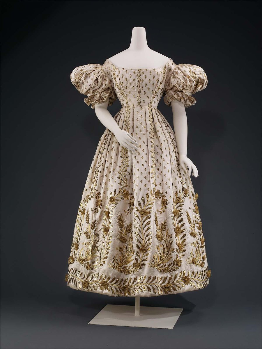 French. Court Dress, c.1830. 'Silk satin embroidered with plain and textured flat gilt wire, sprigs overall, flowers and wheat on sleeves and at skirt base, three dimensional flowers and wheat kernels over wire and net foundations.' ©️ @mfaboston #FashionHistory