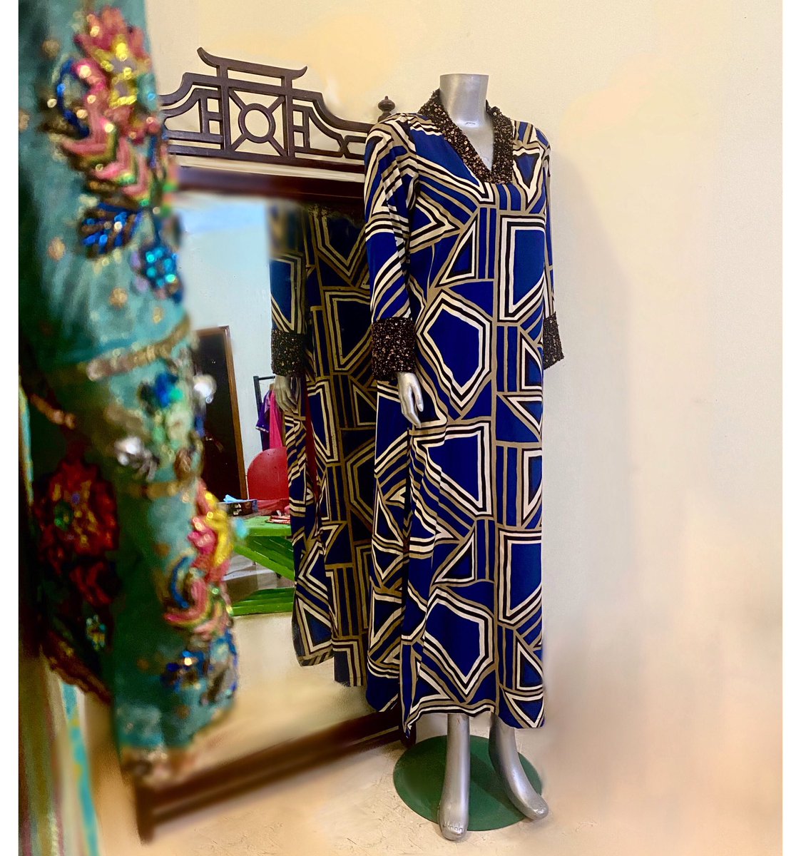 A vintage-inspired abstract print, silk, midi dress complemented with beaded cuffs and neck edgings. It has long slits at the seams and a plunging V-neckline. #fashion #style #fashionnova #fashionblogger #fashioninspo #fashioninsta #nadyamistry #funfashion #fashionista #vintage