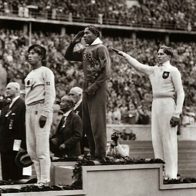 Jesse Owens of USA winning gold for the long jump in the summer Olympics in Germany, 1936.⁣⁣ ⁣⁣ The man saluting behind Owens is Lutz Long, a German who shared training tips with Owens and was the first to openly congratulate him after his final jump in full view of Hitler.…