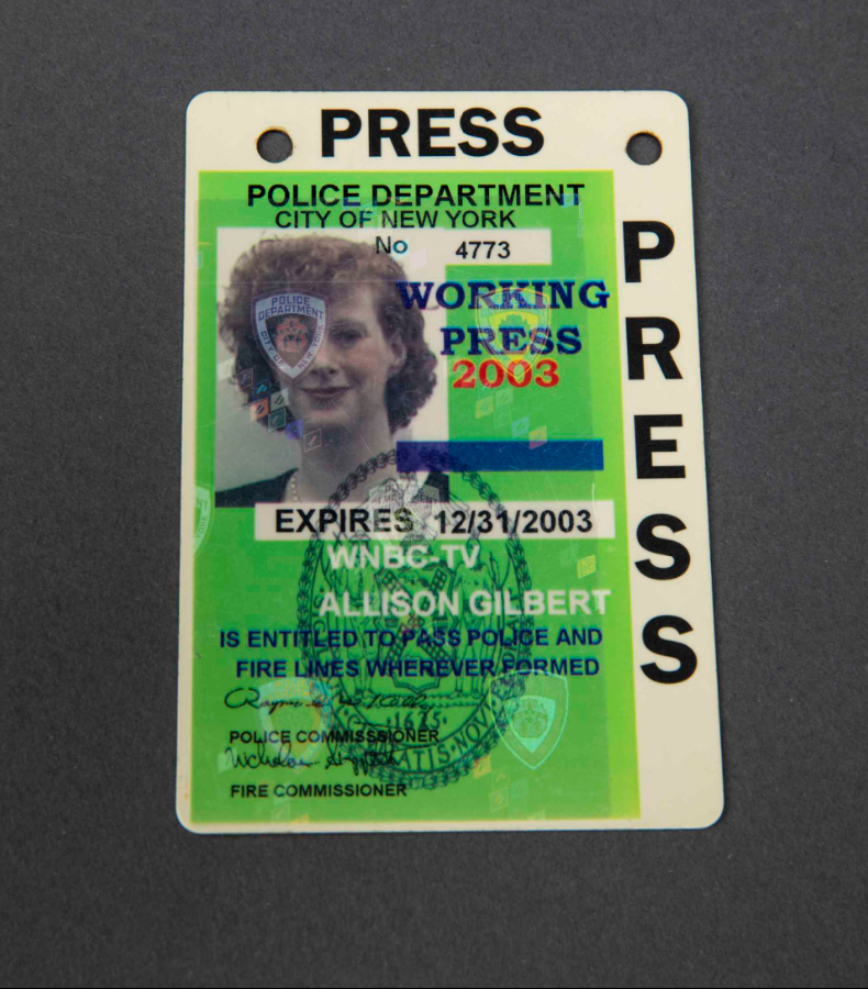 Press pass belonging to Allison Gilbert of WNBC-TV. Gilbert, an investigative producer, covered the breaking news of a plane striking the WTC. Covered in dust following the collapse of the towers, she transmitted a live report on what she had seen. #WomensHistoryMonth