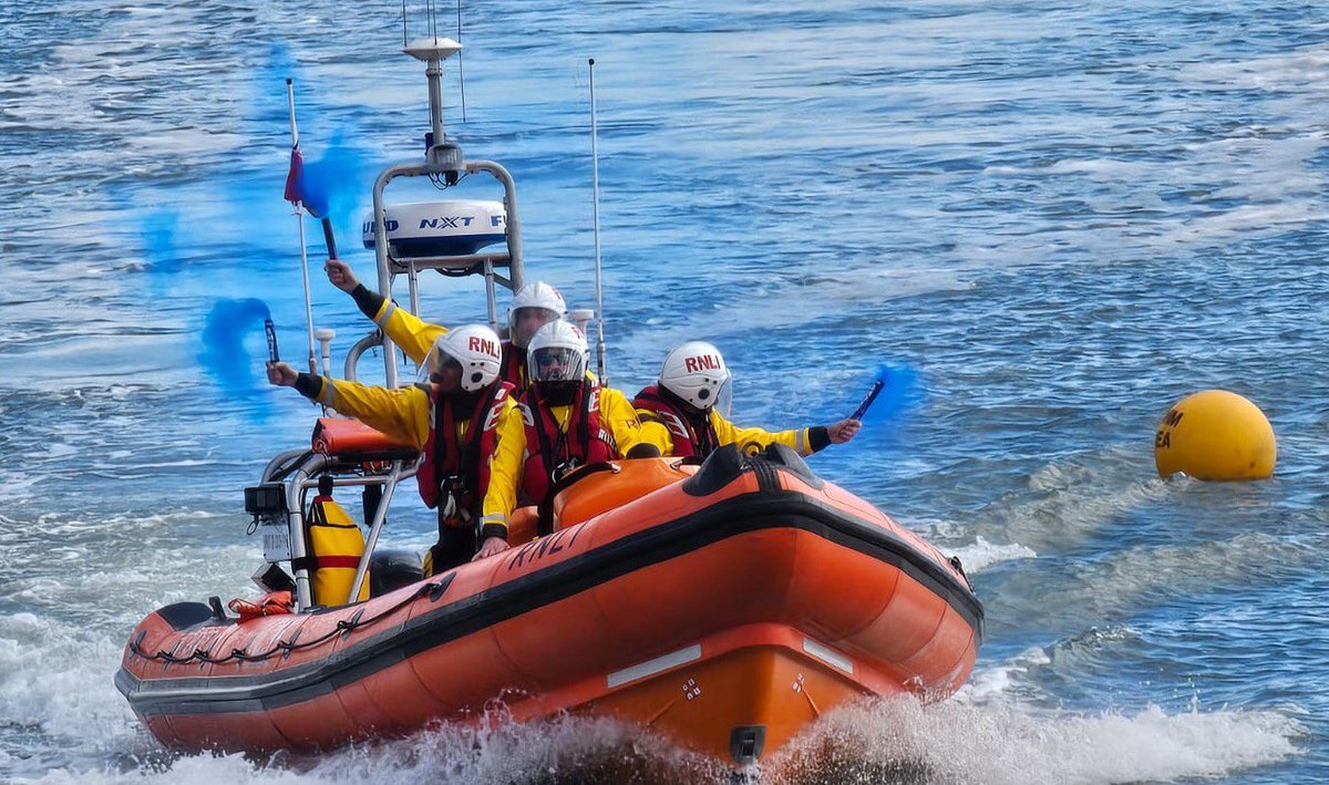 LymeRegisRNLI's tweet photo. Lyme Regis lifeboat crew @sebcope &amp; his fiancee are expecting a baby in August. They held an American-style gender reveal event with a difference. While aboard the lifeboat his fiancee Abbie Cook was on the north wall watching with crowds as blue flares signalled Its a boy! 🥳 https://t.co/DqgrxXb02g