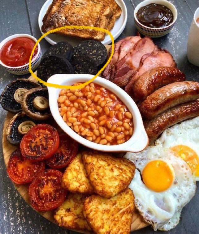 JoeBPose's tweet photo. @dro_ghost Easy, whatever these bricks (circled in yellow-orange) are, the whole white unseasoned mushrooms, or my real answer since no one would ever put those other two on a platter - the baked beans. https://t.co/EhDIaPgnc9