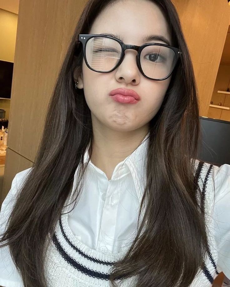 she looks so cute in glasses