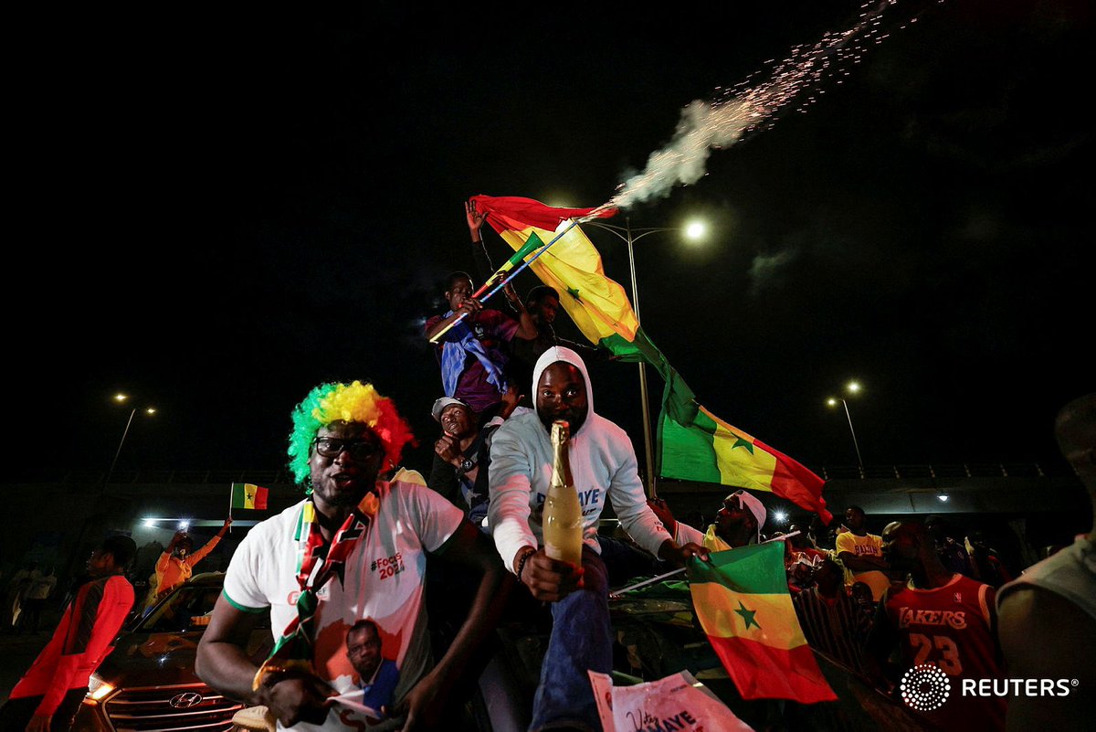 Supporters of Senegalese presidential candidate Bassirou Diomaye Faye celebrate early results showing that Faye is leading initial presidential election tallies, in Dakar, Senegal, March 24, 2024. REUTERS/Zohra Bensemra #Kebetu #Senegal #SunuElection