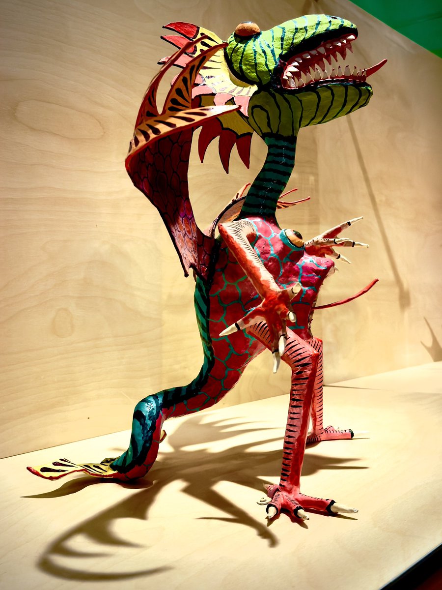 “Alebrijes are brightly colored Mexican folk art sculptures depicting fantastical creatures or familiar animals. They can have horns, antlers, wings, fangs, fins, scales, human bodies, and some have all at once.” moifa.org