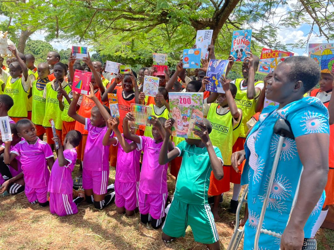 AligumaFound's tweet photo. Introducing Kahaara Primary School, led by an inspiring individual with a disability. We were deeply impressed by the remarkable work she is doing with the children. The pupils were also thrilled to receive gifts from the @UEFA president and the team from Slovenia. https://t.co/s1jOUV10em