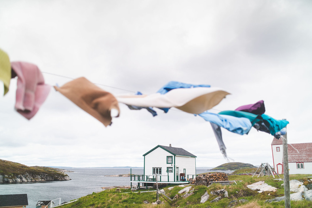 Discover the timeless nature and strong cultural heritage of Newfoundland and Labrador as captured by the simple sight of laundry on the line. 🌊