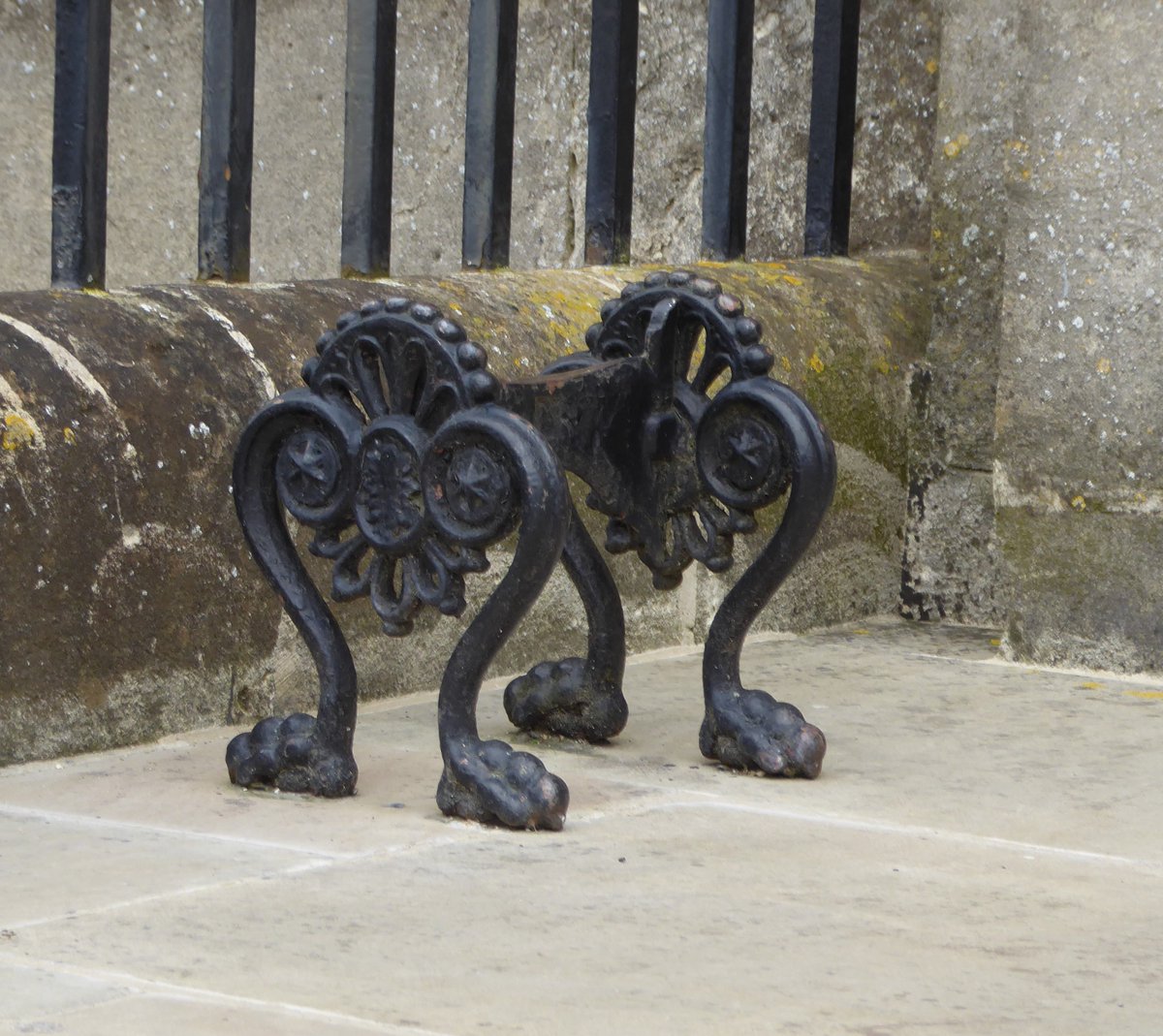 #AllMetalMonday  Charming boot scraper in Stockbridge, Hampshire (left).

And sophisticated city boot scraper, in Bath (right).  I do find those strangely 'knuckly' feet & toes a little bit comical.