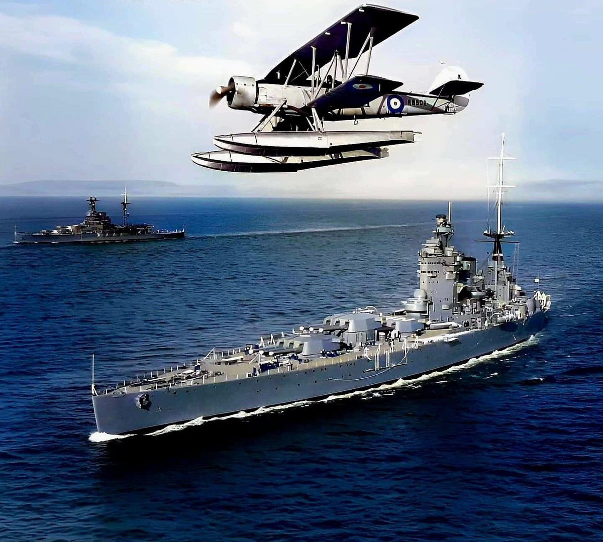 🇬🇧 Royal Navy Battleships HMS Nelson and HMS Royal Oak underway at sea off Weymouth with a Blackburn Shark II flying up above in 1938 🏴󠁧󠁢󠁥󠁮󠁧󠁿