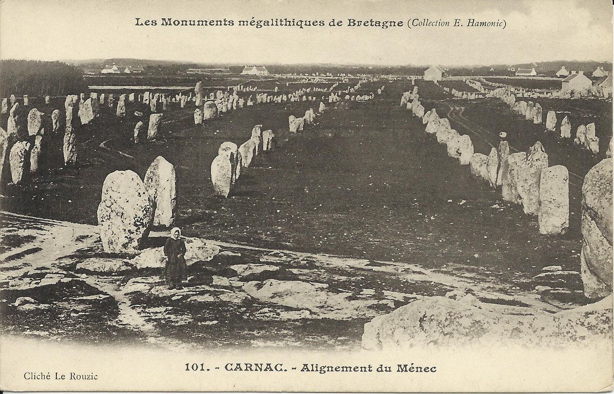 This is one of the more expansive views of the alignments of over 1100 menhirs in 12 rows at Menec in Carnac (Morbihan) published by Hamonic in his Monuments mégalithiques de Bretagne series before 1903. The negative was taken by Carnac archaeoligist Zacharie Le Rouzic.