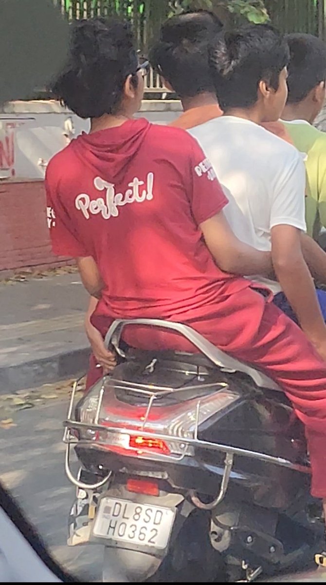 iambagwadi's tweet photo. @dtptraffic @DelhiPolice Four underage boys riding a scooter on the main road without wearing helmets or any safety precautions on the morning of Holi.This poses a danger not only to the children themselves but also to other road users.  
DL 8SDH0362 https://t.co/OWzRy6Yye8