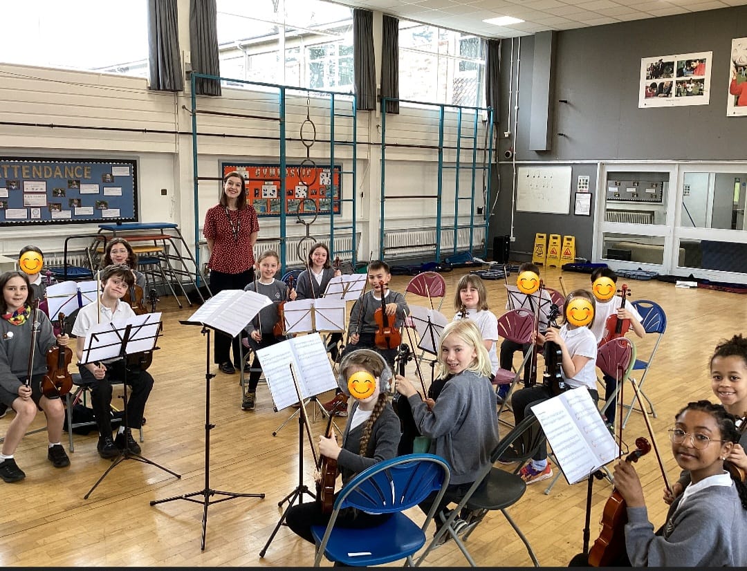 Mrs Evans and the Manley Park violinists having lots of fun at their orchestra morning last week! @mppsch 🎻🌟🎶