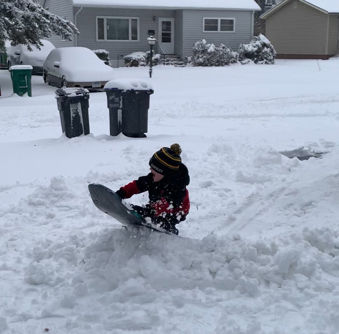Snow day means building sled jumps in the front yard with the boys!
