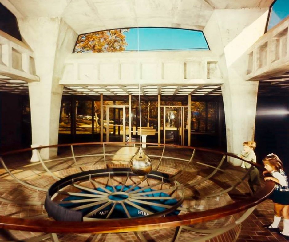 This 1970 photo captures our iconic Foucault Pendulum in its former home at Greenwood-Ashworth Park. Today, it mesmerizes visitors at SCI while revealing the Earth's rotation with its 235-pound swinging pendulum!