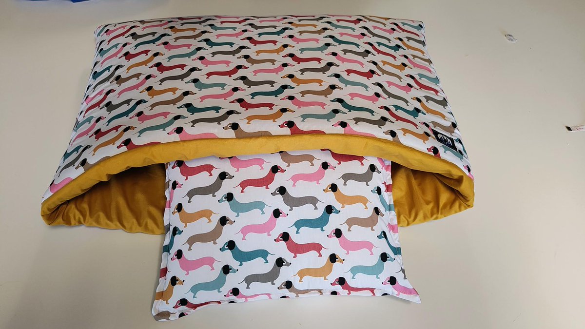 "Great news for my customers burrowing dachshund! They were looking for a Snuggle Wrap Bed in a more lightweight fabric for all weathers, so I found some fantastic poly-cotton blend.  Here's your pup's brand new Snuggle Wrap, featuring an adorable dachshund design!"
As a bespoke