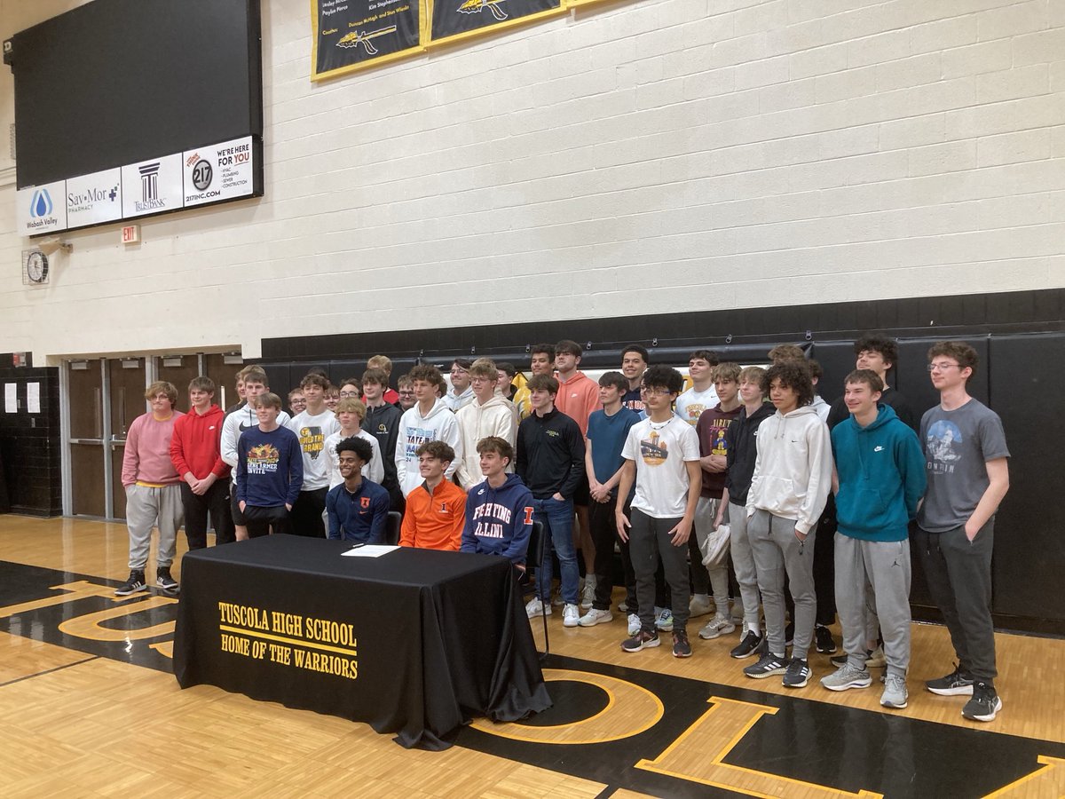 Congratulations go out to Jackson Barrett for his commitment to run at the University of Illinois. He’s seen here at today’s ceremony surrounded by family and teammates.