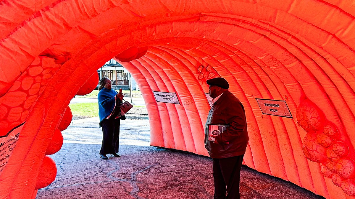 Colleagues and community members joined @SamAkinyeyeMD to light @OhioState's East Hospital tower blue—and tour an inflatable colon—to support #ColorectalCancer patients, and to raise awareness of the importance of screening and prevention. #ColorectalCancerAwarenessMonth