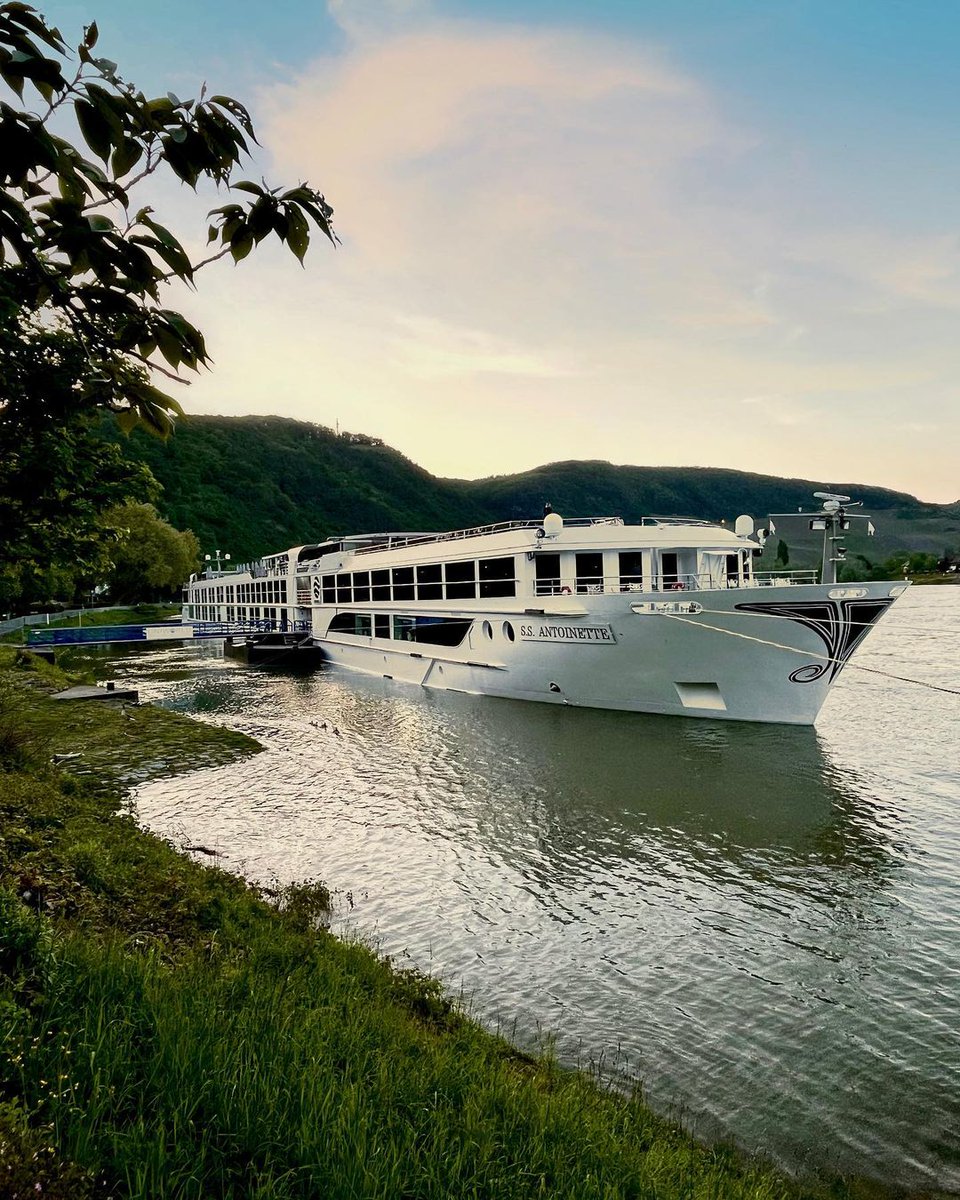 Our beautiful S.S. Antoinette docked with a picturesque sunset in Boppard. #ExploreUniworld 📷 Cruise Manager Martin