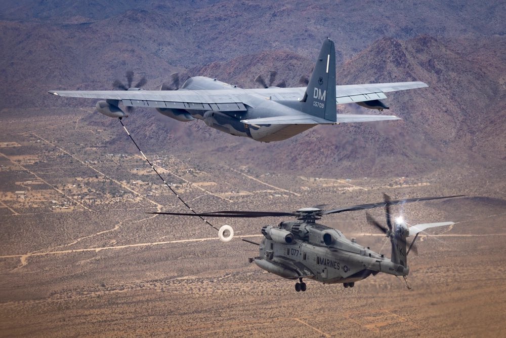 A @USMC CH-53E Super Stallion with HMH-462 conducts air-to-air refueling with a @usairforce HC-130J Combat King II assigned to the 79th Rescue Squadron, near Lake Havasu City, Arizona, Feb. 26, 2024.  #flymarines #aviation #jointservice @DeptofDefense @INDOPACOM