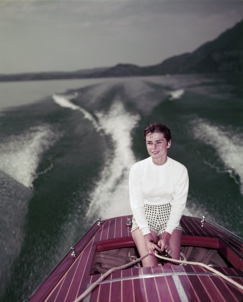 audrey hepburn on a boat on lake lucerne, switzerland, august 1954