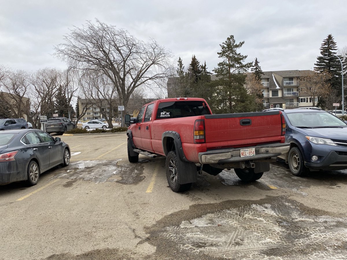 Imagine how special you have to be to be able to park like this. This is in a very small hospital visitor parking lot. What a twit.