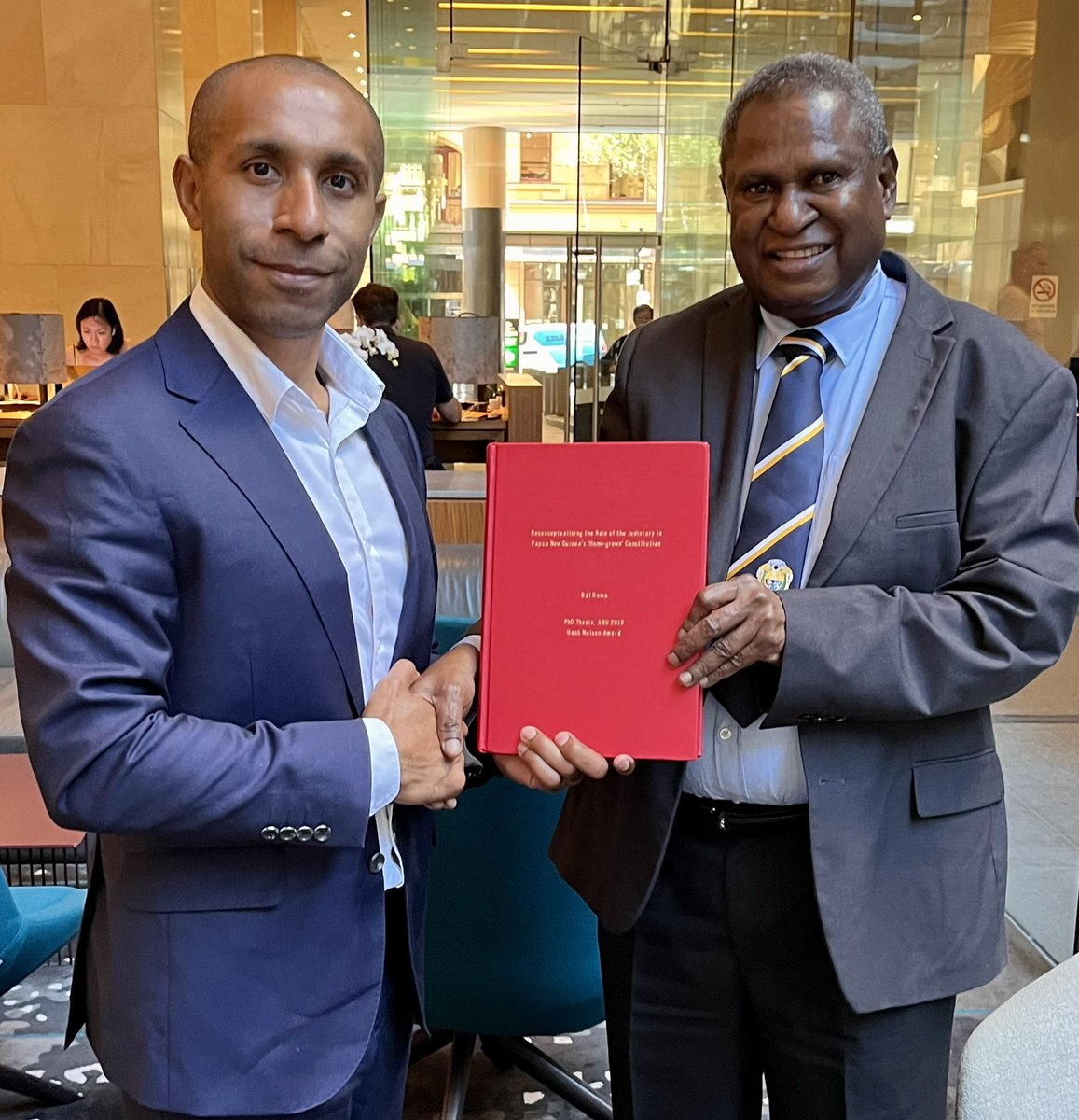 A great honour to present a copy of my award-winning law PhD thesis to the Chief Justice of PNG, Sir G.Salika! It’s the 1st major academic work on the PNG judiciary. His interest to read & avail for fellow judges is immensely appreciated. I pray the thesis inspires their work.