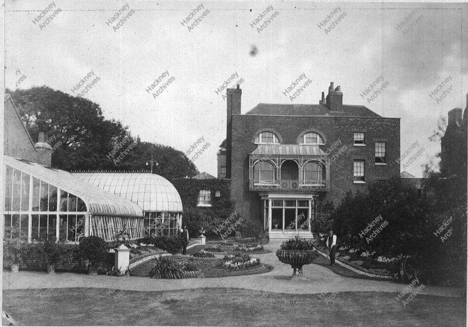 NEWINGTON GREEN. WEST SIDE. c1878 Back elevation of Mr Bowerbank's house, also showing greenhouses and gardener. View looking south [house was on north-west corner of NewingtonGreen.) Photograph: E.A.Storey.1878