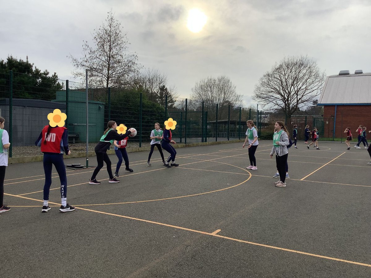 Netball players of various ages gathered in Leominster for a mixed-age 'B' tournament. Teams from John Kyrle school displayed resilience and teamwork, forming strong bonds despite challenging matches. Netball activities will resume in the autumn. #JKHS #Netball #community