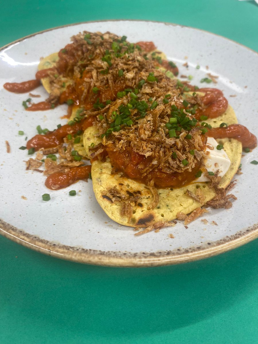 Our Spring menu is live! 💚 

We have created a range of new dishes including these delicious Gram Fritters with courgette &amp; peas, sour cream, salsa, crispy onions, spring onion, scotch bonnet &amp; tomato sauce.

Check out our new menu on our website - link in bio