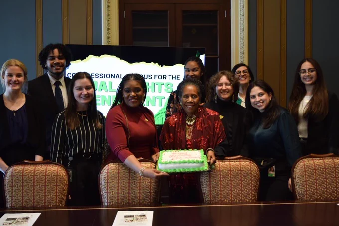 Congresswoman Bush and Congresswoman Sheila Jackson Lee display ERA Anniversary cake