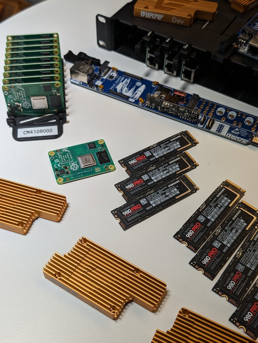 Merocle's tweet image. What a mess. Assembling 19-inch BladeRunner. 
How do you like the gold heatsink, by the way? Just made some samples by mistake.

#computeblade #raspberrypi