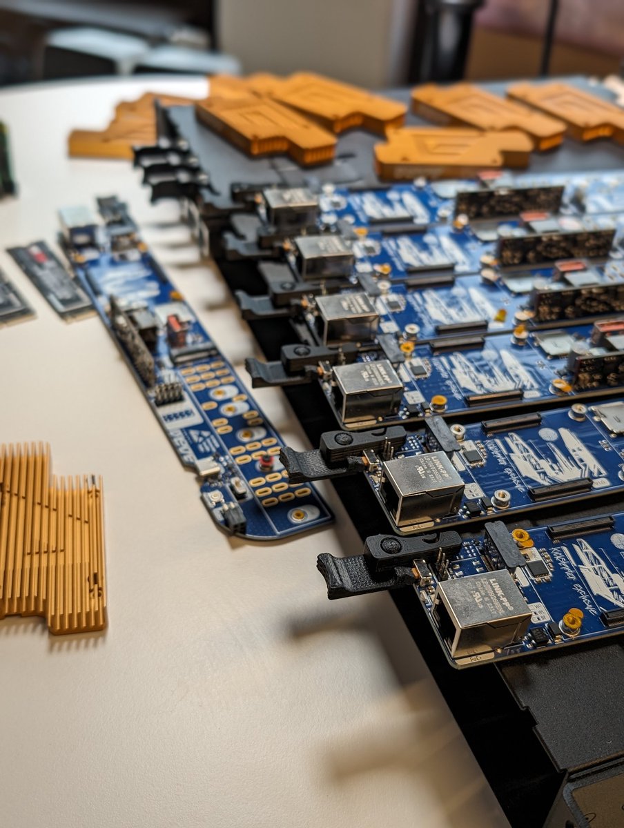 Merocle's tweet image. What a mess. Assembling 19-inch BladeRunner. 
How do you like the gold heatsink, by the way? Just made some samples by mistake.

#computeblade #raspberrypi